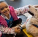 Comfort Dog provides support to a disaster survivor at a FEMA Recovery Center in Long Beach, NY