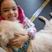 Comfort Dog provides support to a disaster survivor at a FEMA Recovery Center in Long Beach, NY