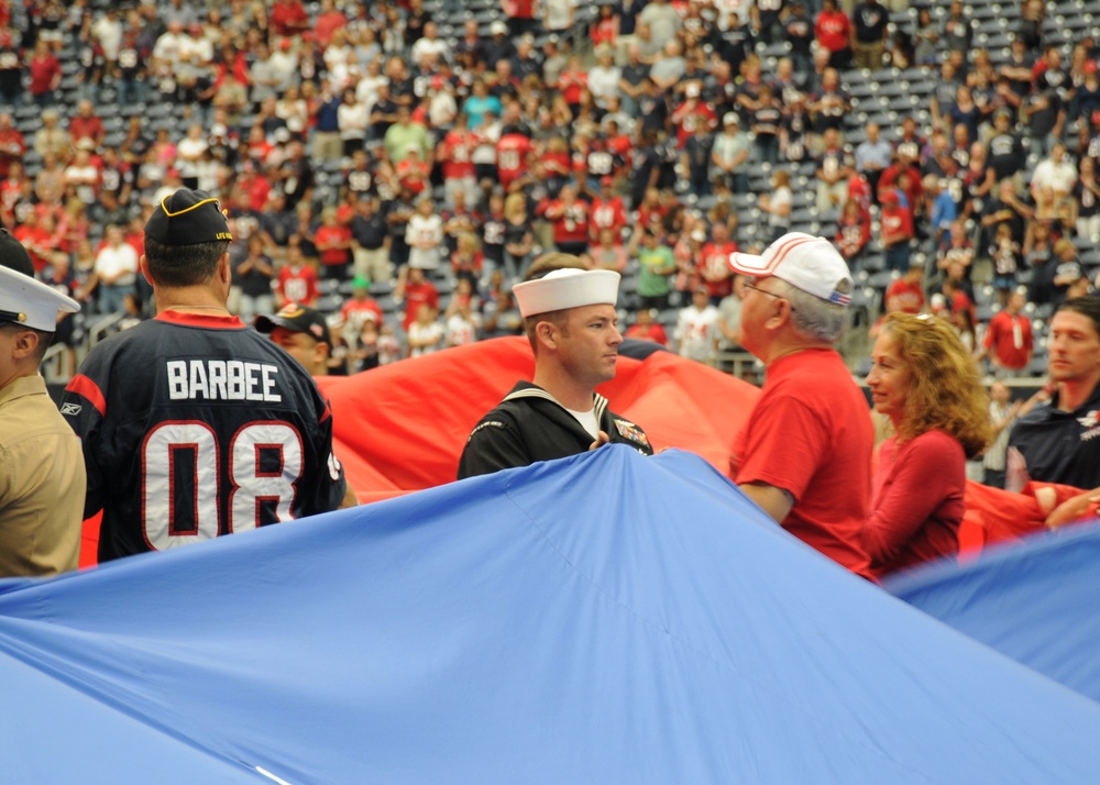 USS George H.W. Bush honors its namesake at football game