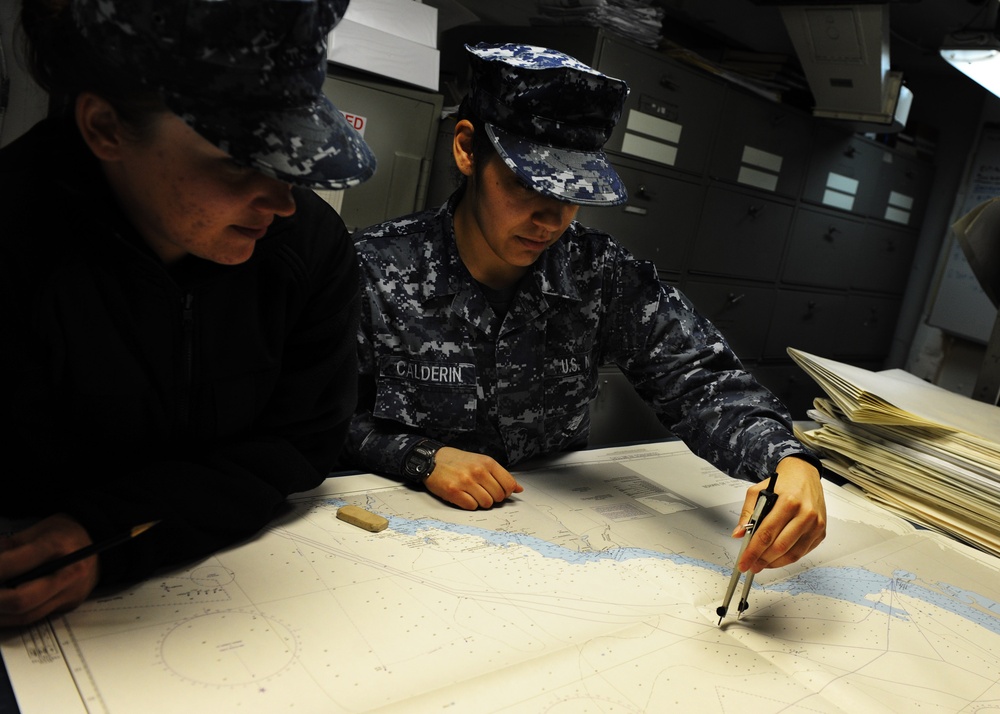 Sailors plot points on map