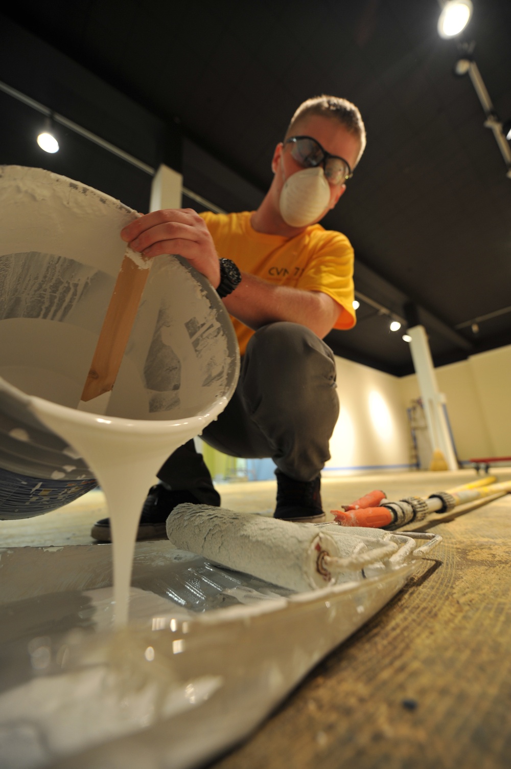 USS George H.W. Bush sailor prepares to paint