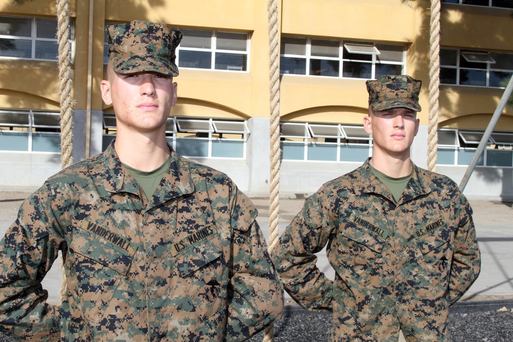Competitive twins complete recruit training together