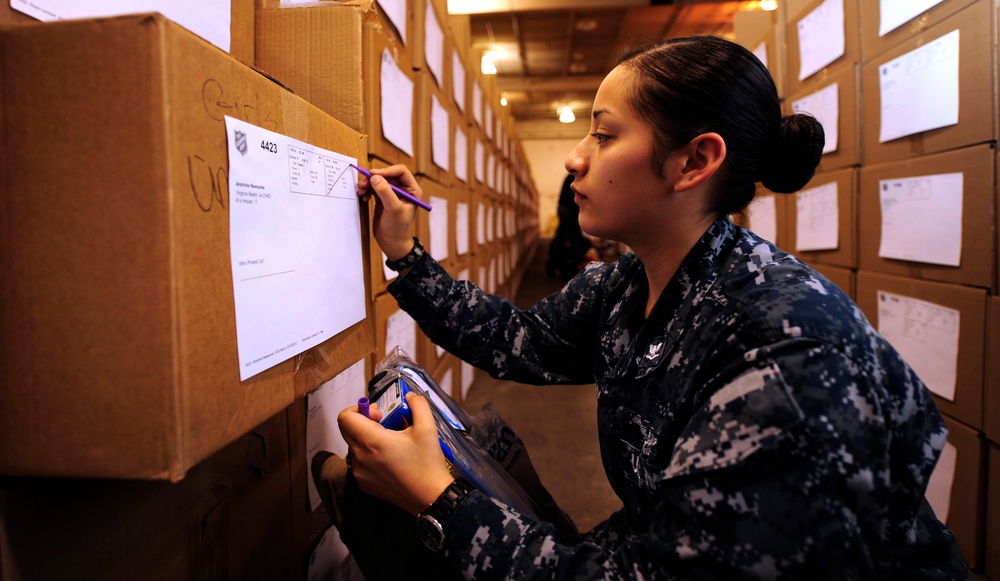 USS Theodore Roosevelt sailors provide Christmas presents to needy children