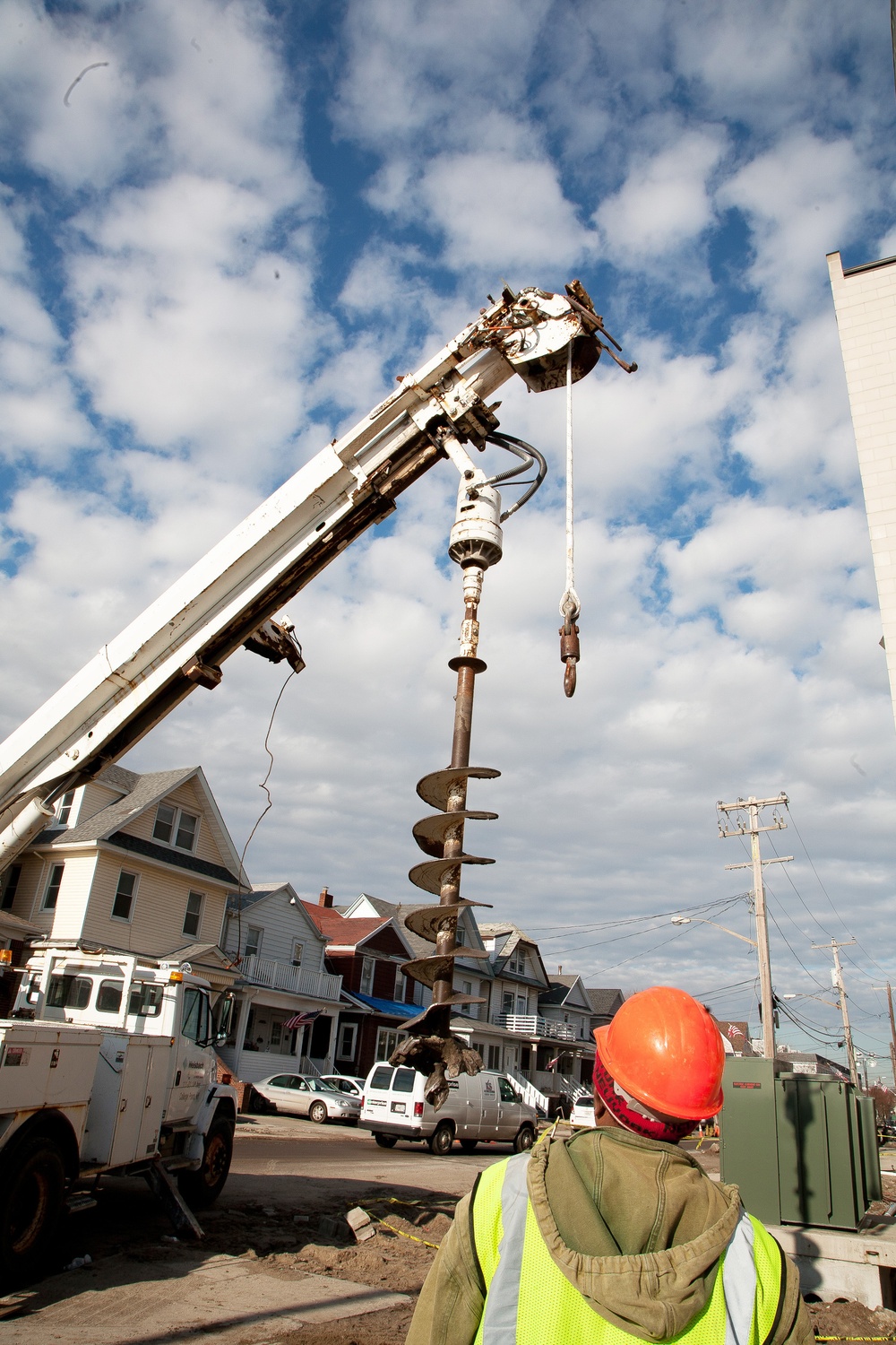 Powerful drills make holes for new poles