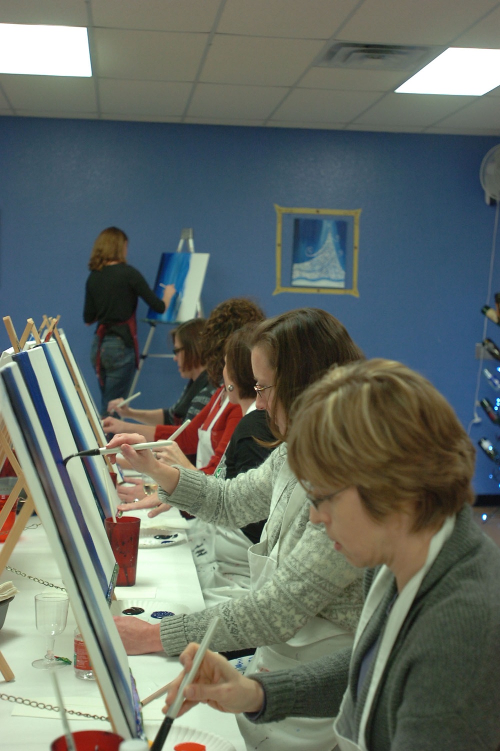 Spouses add Cav flare to Painting with a Twist party