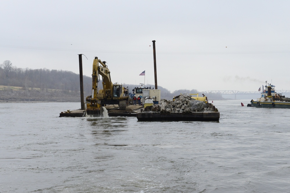 Equipment removing rock on the Mississippi River