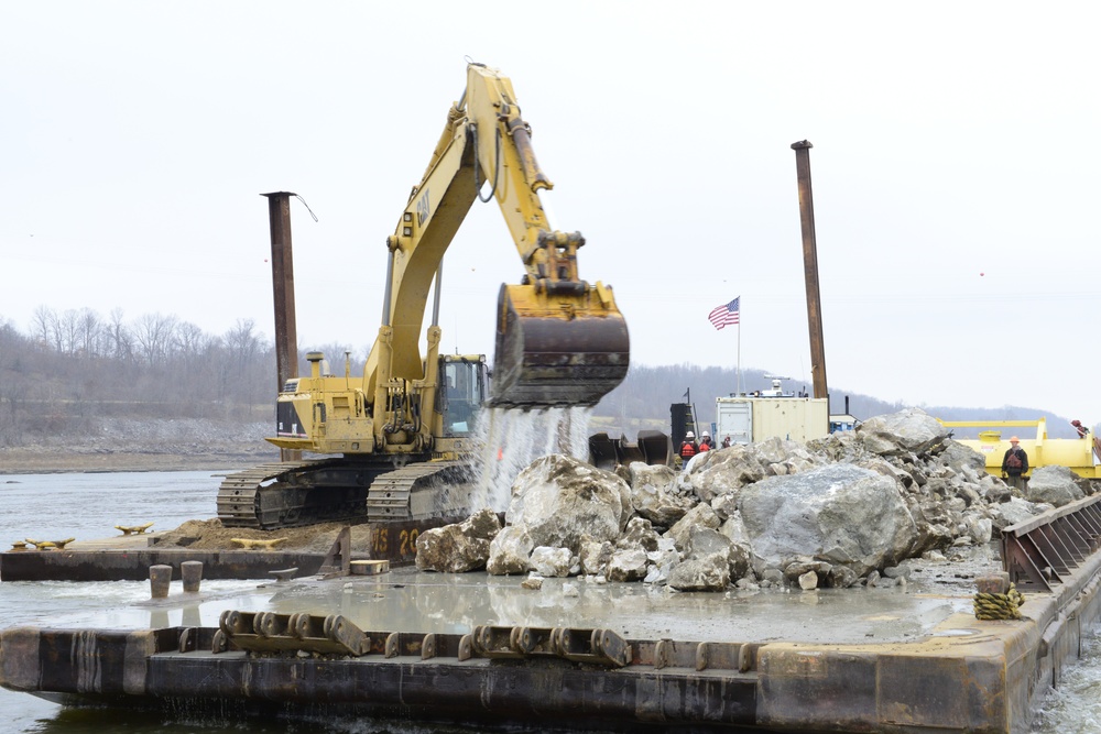 Loading spud onto barge