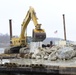 Loading spud onto barge