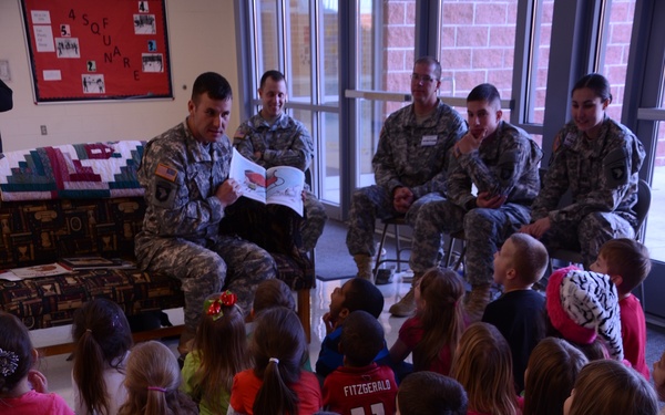 Soldiers read to young children