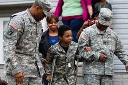 Soldiers help boy live military dream