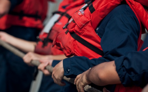 Sailors heave a line