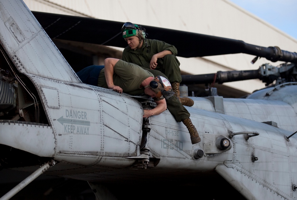 Marines maintain helicopters during holidays
