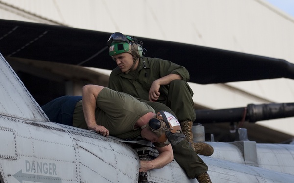 Marines maintain helicopters during holidays