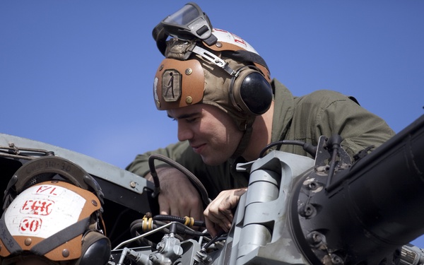 Marines maintain helicopters during holidays