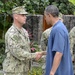 President Barack Obama shakes the hand of Senior Chief Builder James Dolan