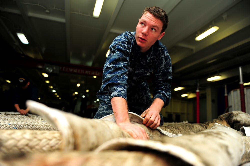 USS George H.W. Bush sailor at work