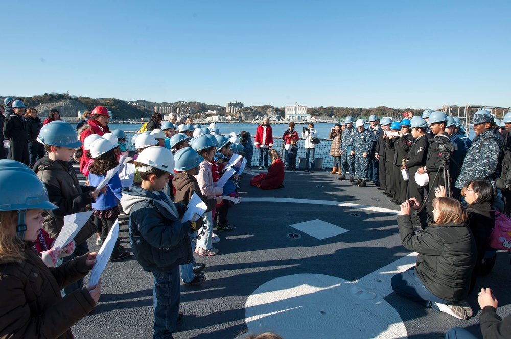 Ikego student carolers bring the sounds of the season to local ships