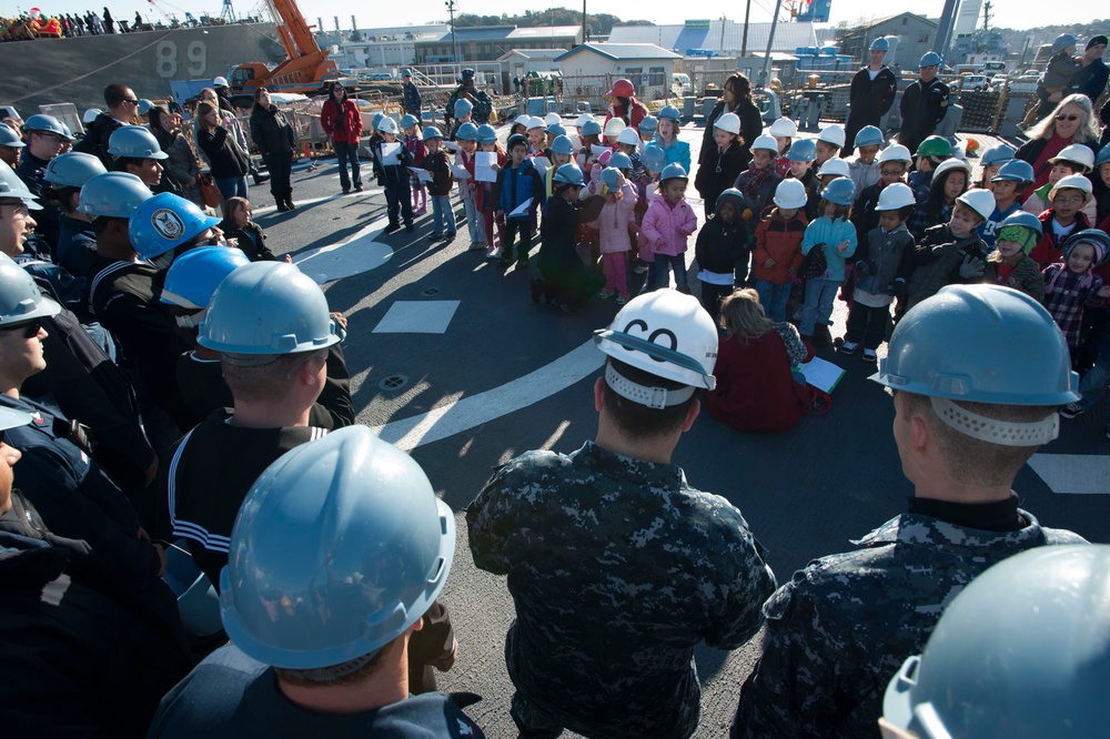 Ikego student carolers bring the sounds of the season to local ships