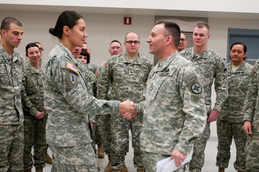 1st Lt. Athena Dewaters presented with coin by Brig. Gen. I. Neal Black