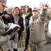 Sgt. Sara Walter from 253rd Military Police Company in Tennessee helps an inauguration attendee