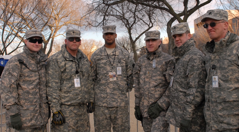 Soldiers from the Pennsylvania Army National Guard stop to pose for a photo