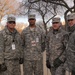 Soldiers from the Pennsylvania Army National Guard stop to pose for a photo