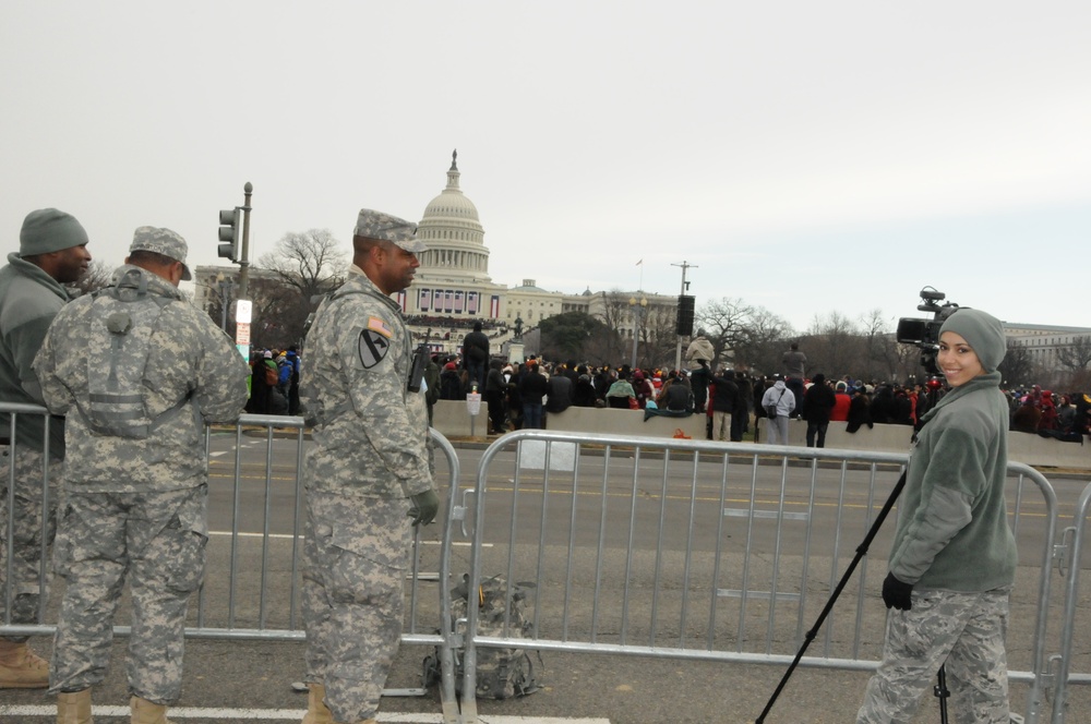 Staff Sgt. Tabitha Gomes, a broadcaster from the 113th Wing, District of Columbia Air National Guard, tapes the swearing-in ceremony