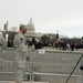 Staff Sgt. Tabitha Gomes, a broadcaster from the 113th Wing, District of Columbia Air National Guard, tapes the swearing-in ceremony