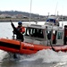 The Coast Guard patrols the Potomac River, enforcing security zones during the 57th Presidential Inauguration.