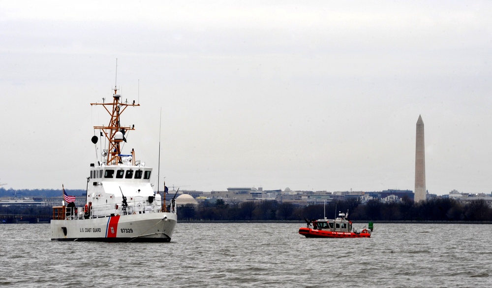 The Coast Guard patrols the Potomac River, enforcing security zones during the 57th Presidential Inauguration.