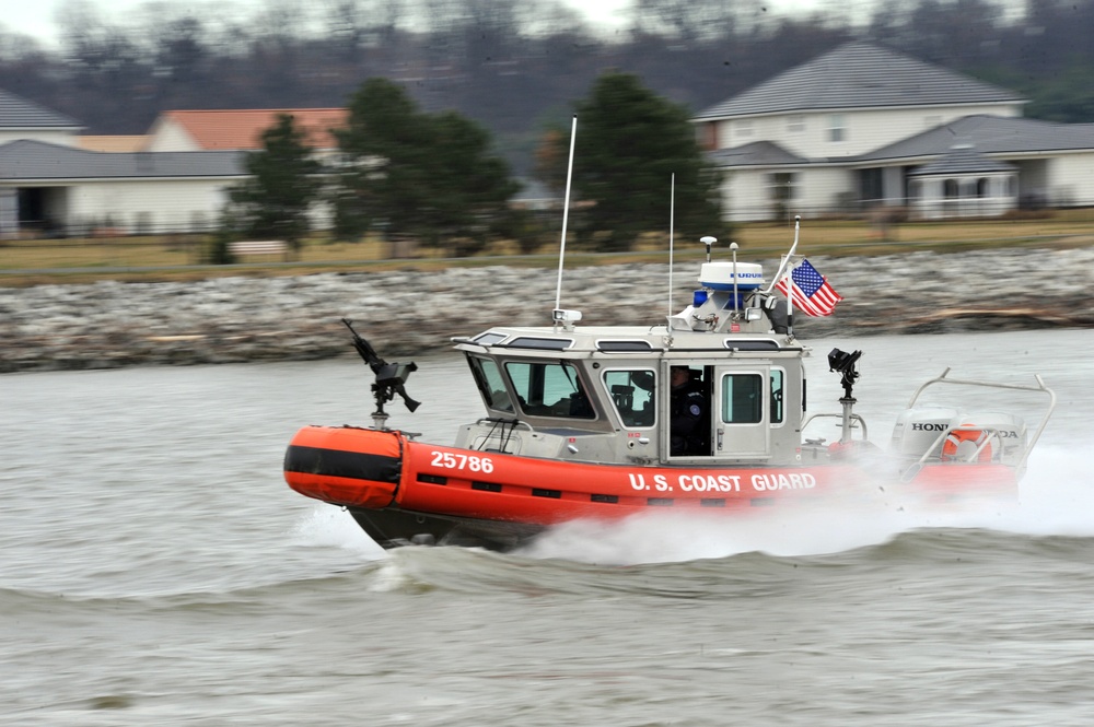 The Coast Guard patrols the Potomac River while enforcing security zones during the 57th Presidential Inauguration.