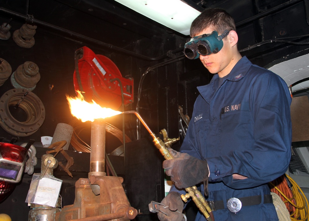 USS George Washington sailor at work