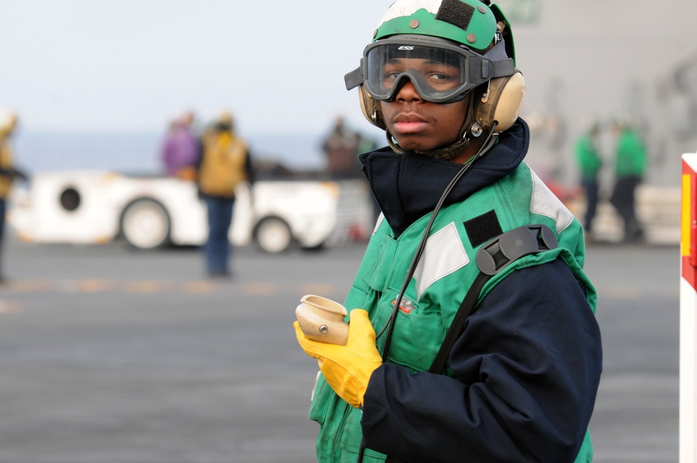 USS George H.W. Bush sailor during flight operations