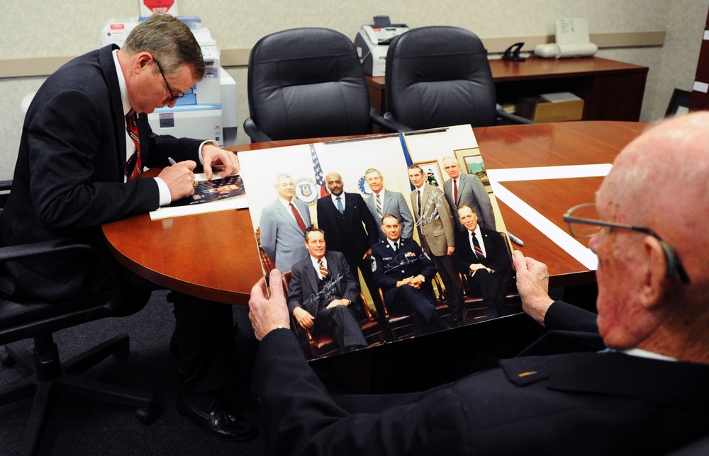 Former CMSAF sign photos