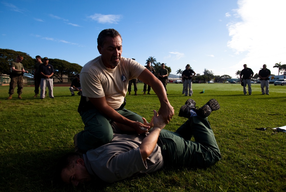 PMO Marines, civilians train with non-lethal weapons