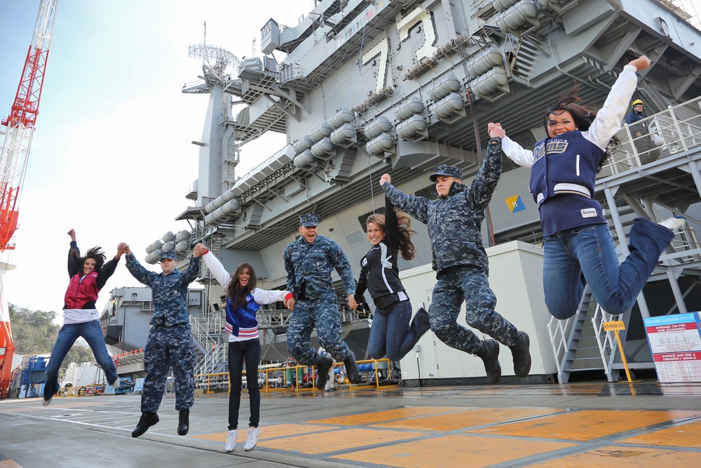 NFL cheerleaders jump with USS George Washington sailors