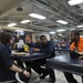 Football players meet sailors aboard USS George H.W. Bush