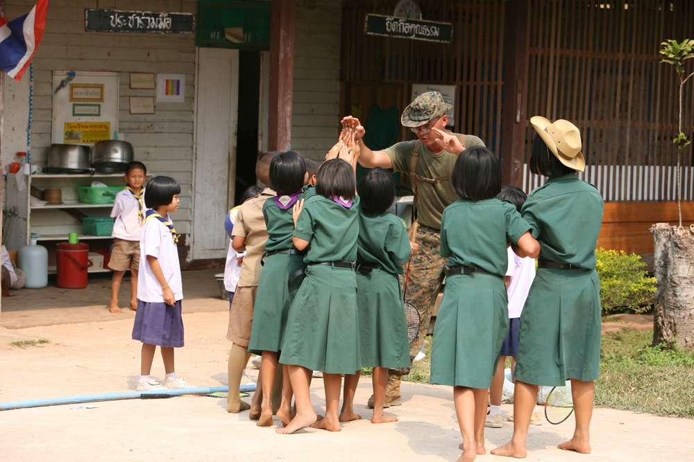 Marine’s journey puts smiles on faces of Thai children