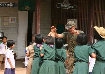 Marine’s journey puts smiles on faces of Thai children