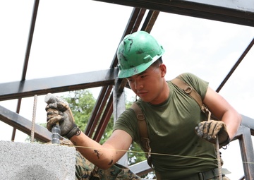 Marine’s journey puts smiles on faces of Thai children