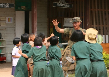 Marine’s journey puts smiles on faces of Thai children
