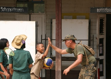 Marine’s journey puts smiles on faces of Thai children