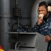 Sailor communicates aboard ship