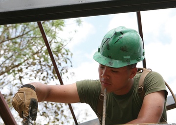 Marine’s journey puts smiles on faces of Thai children