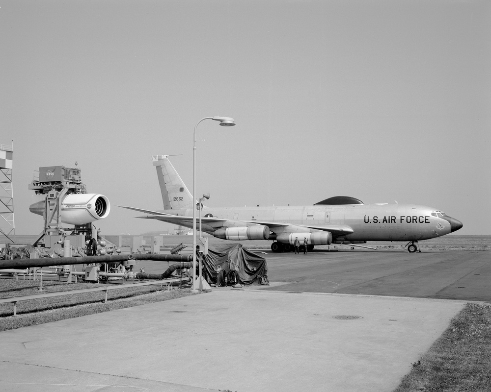 C-135B AIRPLANE BESIDE QUIET ENGINE