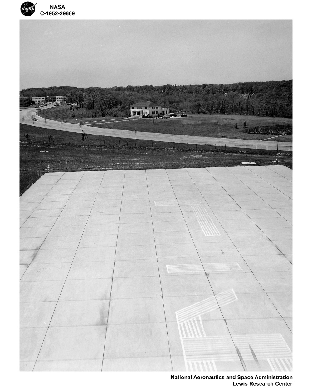 APPROACHES AT TAKE OFFS AND LANDINGS SHOWING ADMINISTRATION SERVICE BUILDING DIRECTLY IN PATH OF CLEVELAND HOPKINS AIRPORT RUNWAY