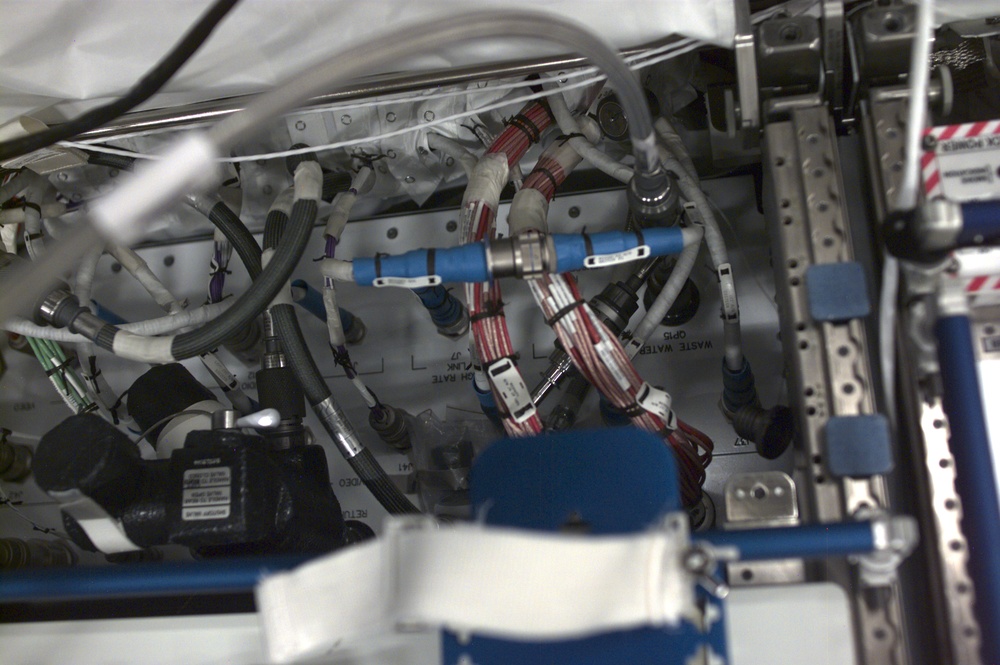 Blurred view of cables in the U.S. Laboratory taken during Expedition Three
