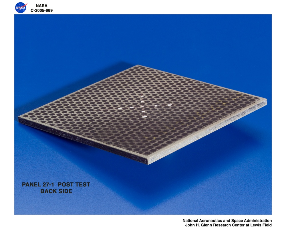 Panel 27-1 post test  RCC carbon / carbon fiber panels - the panels are space shuttle tile material being tested in the ballistics lab building 49