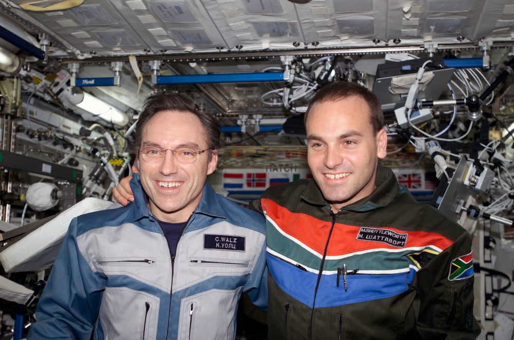 Walz and Shuttleworth pose for a photo in U.S. Lab during Expedition Four