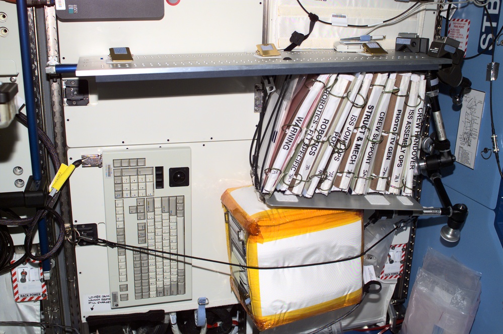 View of a keyboard and notebooks in the U.S. Laboratory during Expedition Three